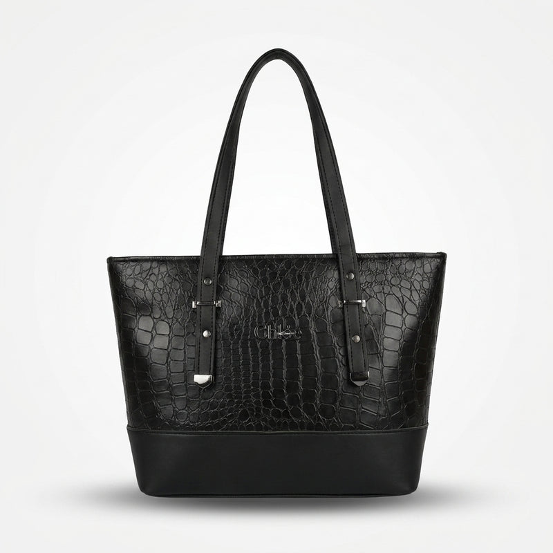 A black crocodile-embossed leather tote bag with dual shoulder straps and silver-tone hardware, shown against a light gray background.