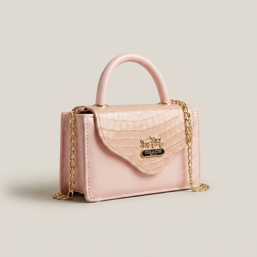 Blush pink croc-embossed mini top-handle bag with gold chain strap